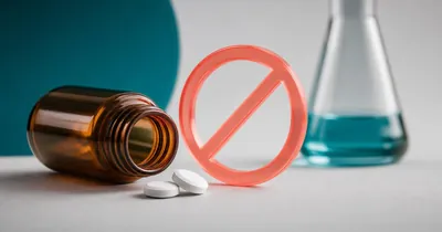 Ranitidine Drug Guide: What It Is, Why It Was Pulled, and What Changed Tipped amber medicine bottle with spilled tablets beside a coral prohibition sign