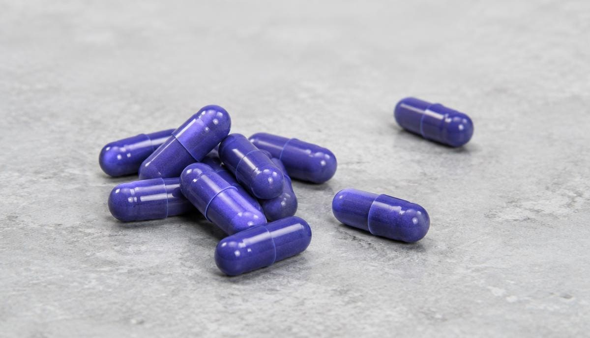 DoseRoutine Colchicine Colchicine tablets photographed on a matte clinical surface